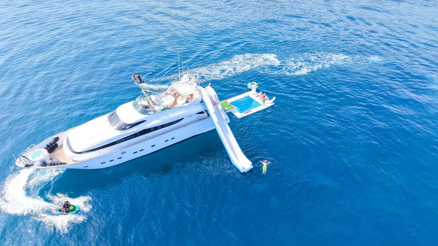 Maiora 26DP Malex at anchor with slide, pool and jet skis alongside