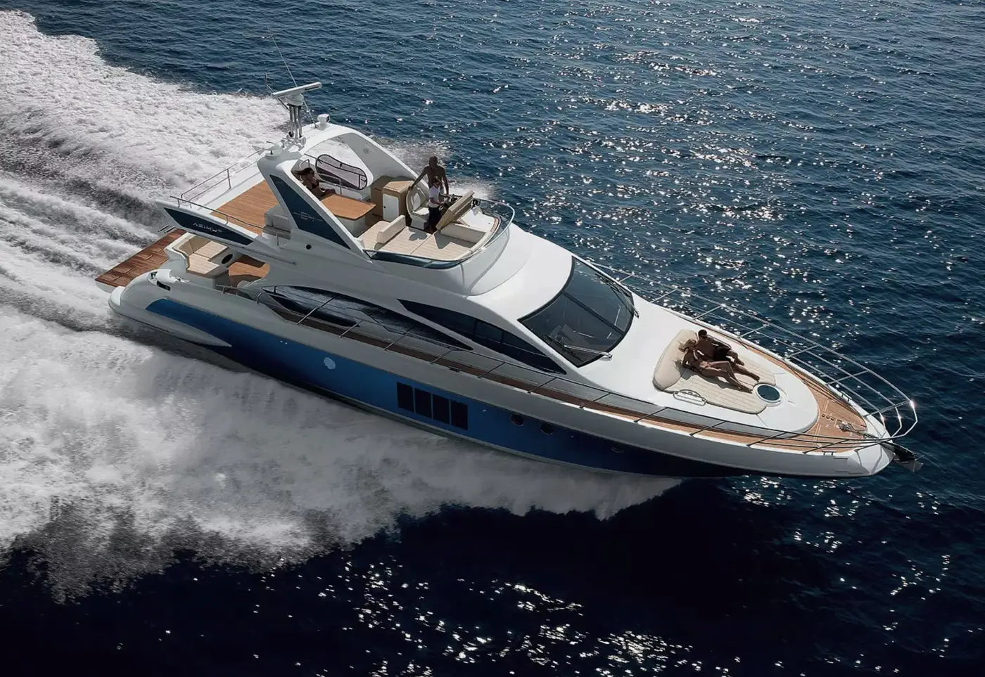 Azimut 58 Fly Lazurit under way, guests on the bow sun pad