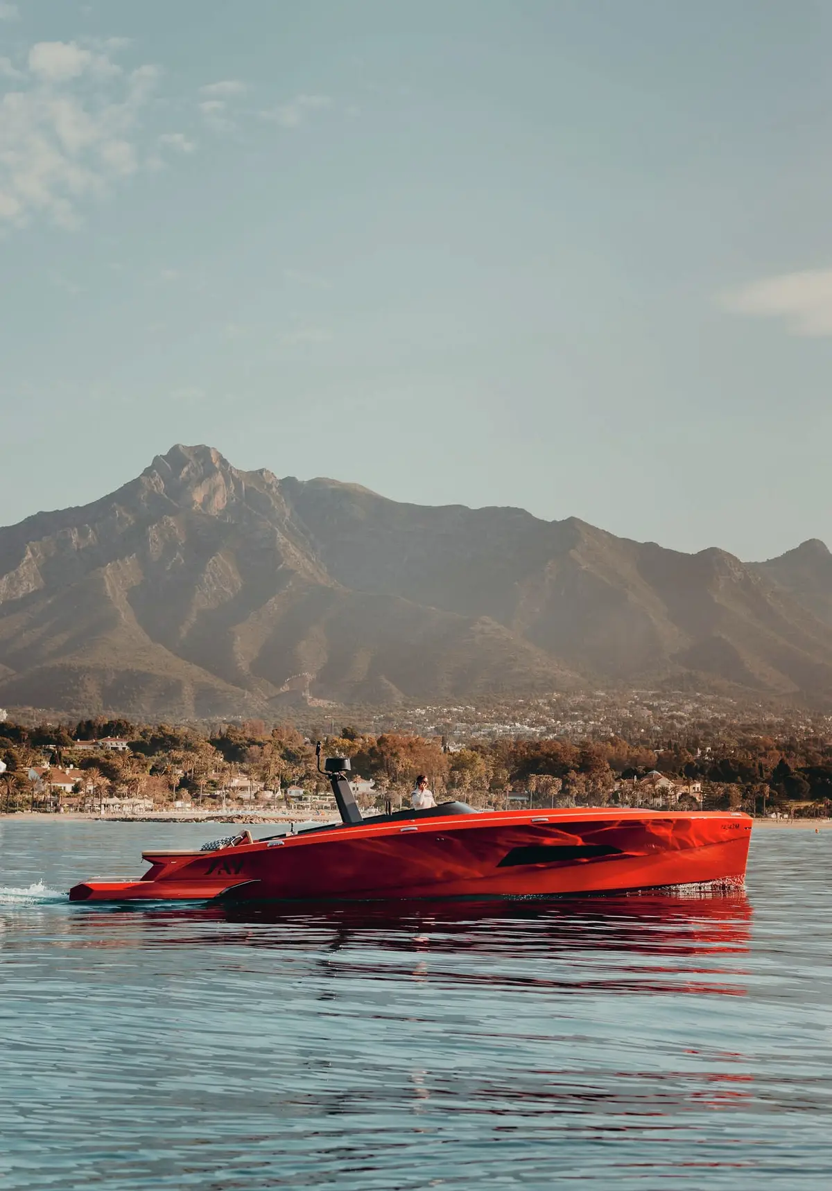 SAY 42 Andalusi cruising off Marbella, mountains behind