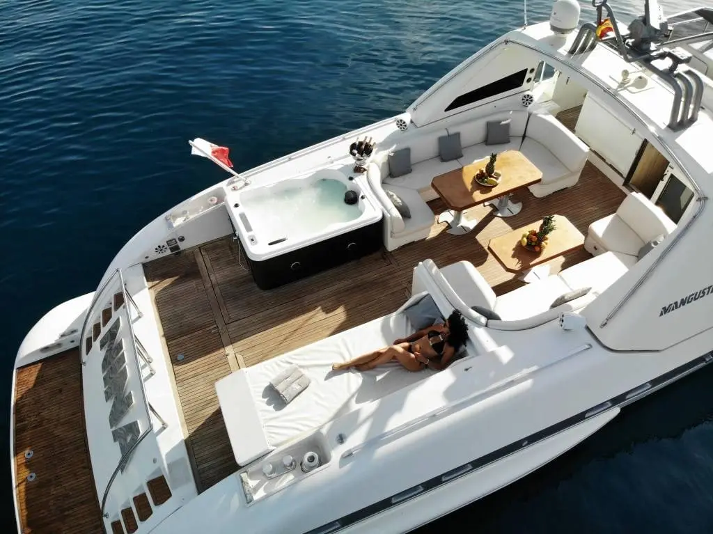 Jacuzzi and shaded dining on the aft deck of Mangusta 80 Nina