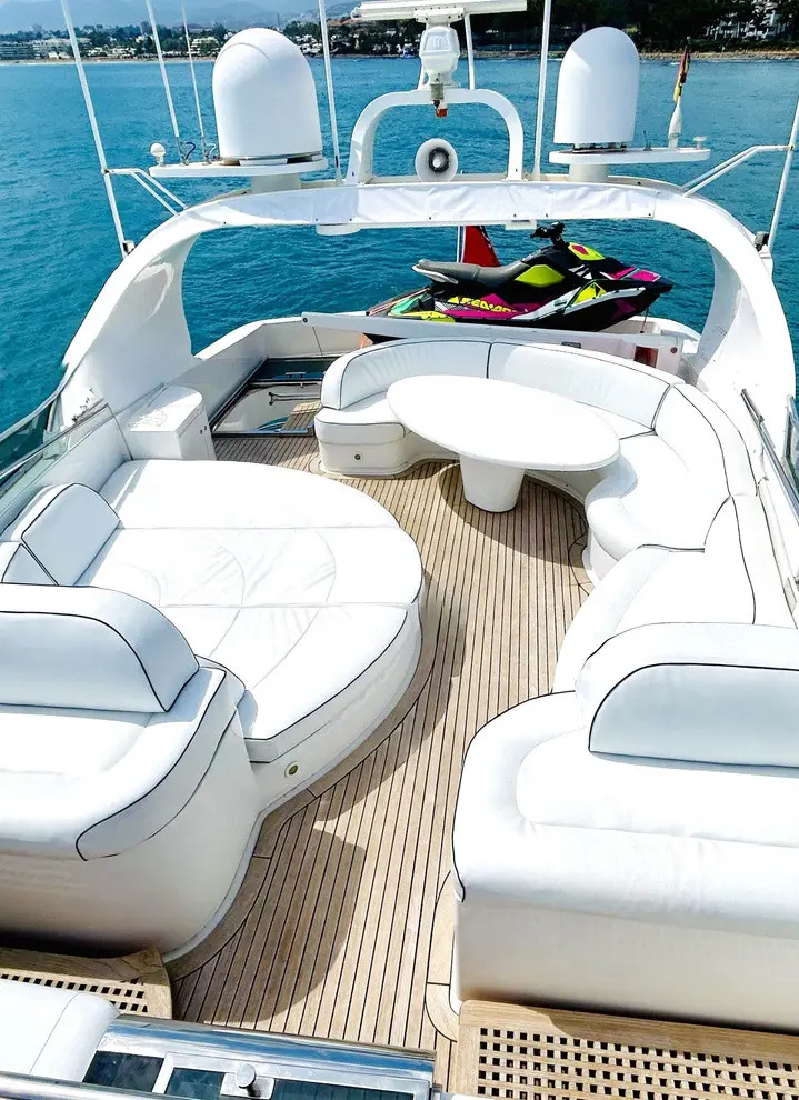 Flybridge seating and table, a jet ski on the top deck