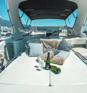 Sun pad under the bimini with champagne and towels on BLTN
