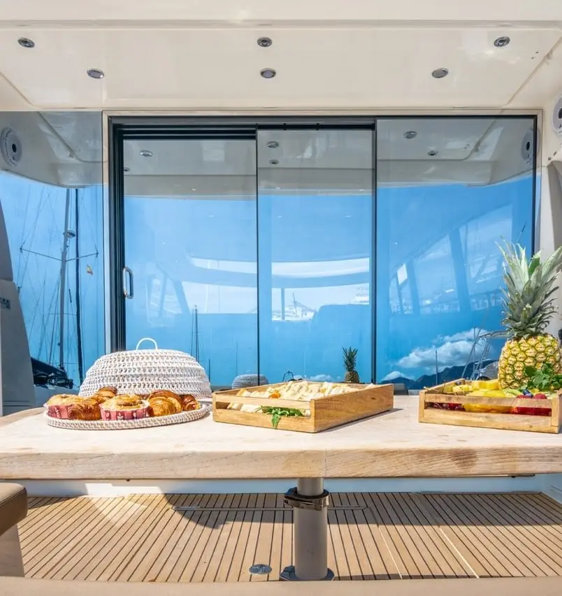 Dining table set with fruit on the aft deck of Prestige 500S La Brisa