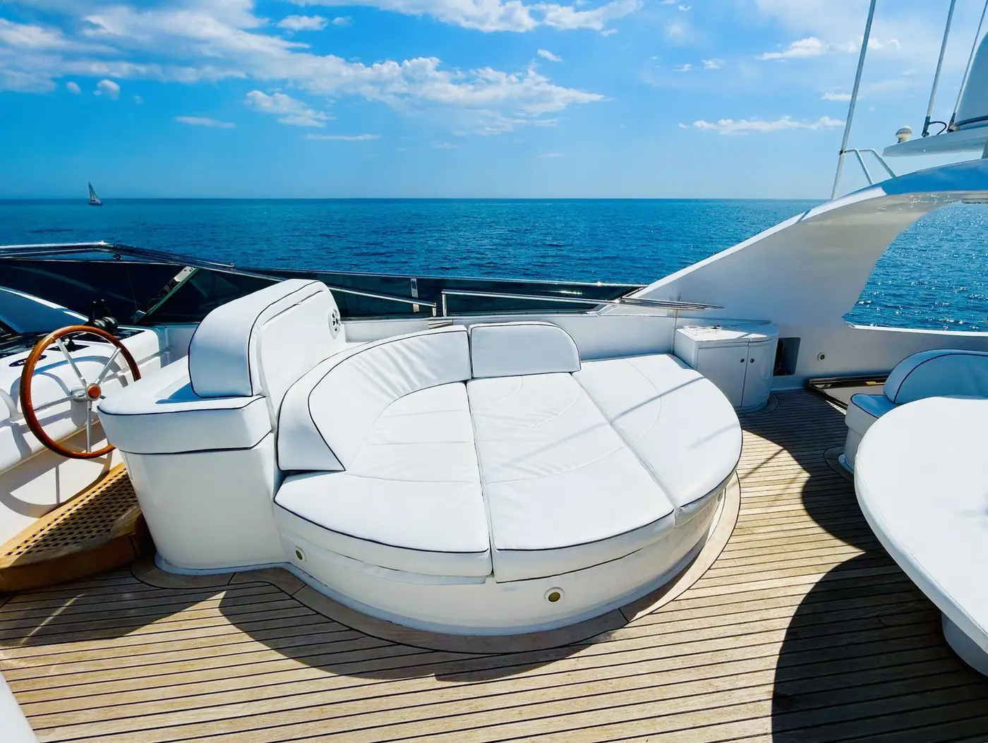 Round sunbed on the flybridge, open sea beyond