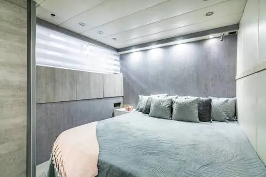 Master cabin with a double bed on Mangusta 80 Nina