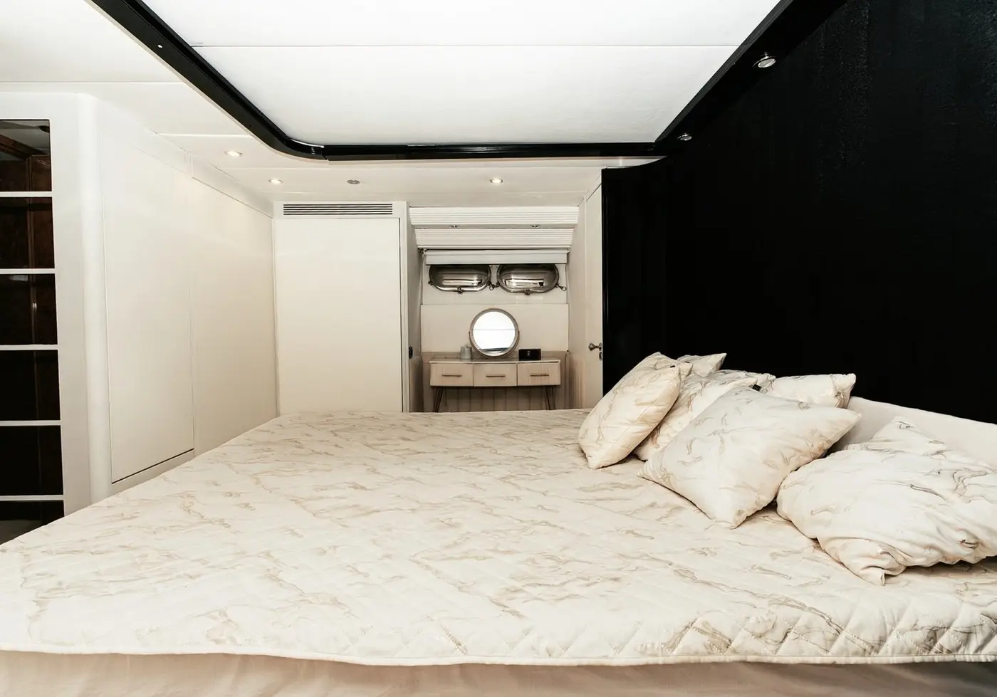 Master cabin with a large double bed and cushions