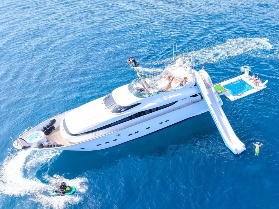 Maiora 26DP Malex at anchor with slide, pool and jet skis alongside