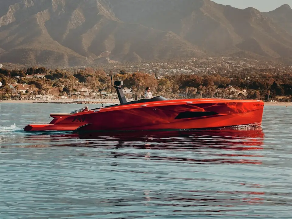 SAY 42 Andalusi cruising off Marbella, mountains behind